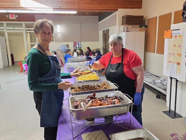 Volunteers serving food at the Easter brunch