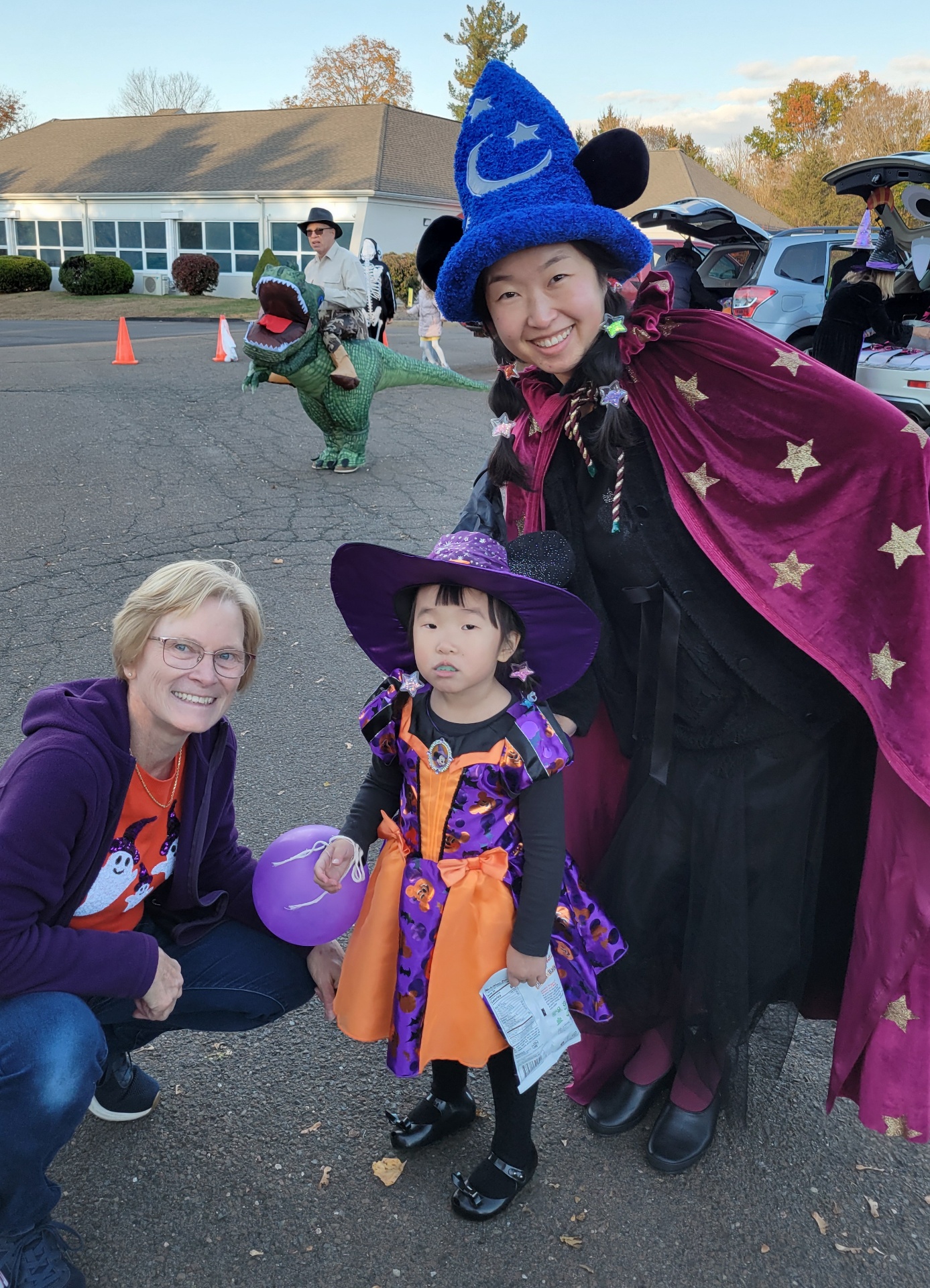 Families in Halloween costumes at Trunk 'n Treat