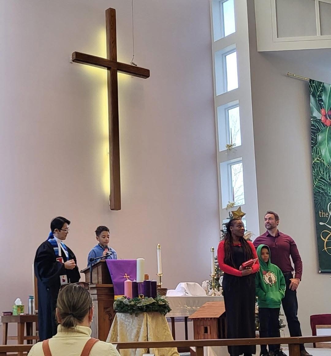 Advent service in the sanctuary with the wooden cross and Advent wreath